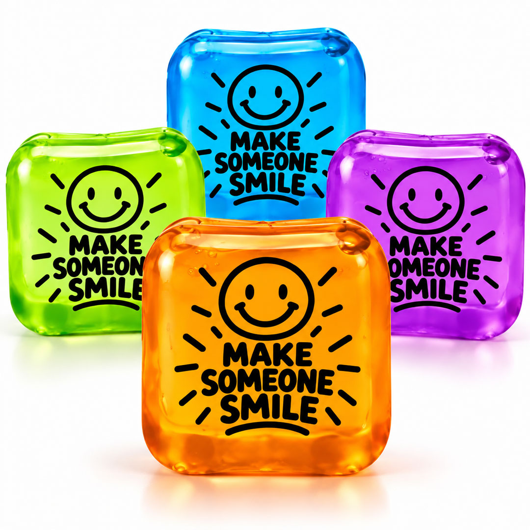 Make Someone Smile Squishy Fidget Cube Make Someone Smile Squishy Fidget Cubes in blue, green, orange and purple featuring cheerful smiley face designs