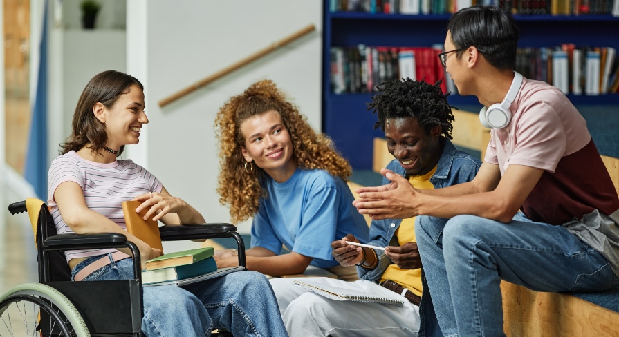 Diverse group of teenagers at school smiling and laughing