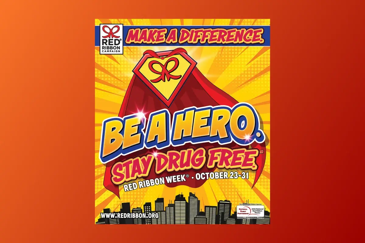Red Ribbon Campaign poster with superhero theme reading 'Make a Difference. Be a Hero. Stay Drug Free.' for Red Ribbon Week, October 23-31, featuring a caped Red Ribbon logo on a bright yellow sunburst background.